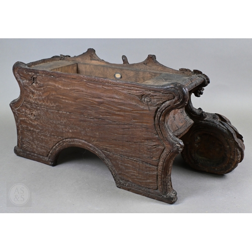 810 - J Huggler (1834-1912) a monumental carved Black Forest clock, late 19th century, carved as a seated ... 