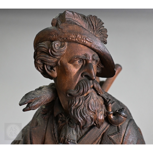 810 - J Huggler (1834-1912) a monumental carved Black Forest clock, late 19th century, carved as a seated ... 