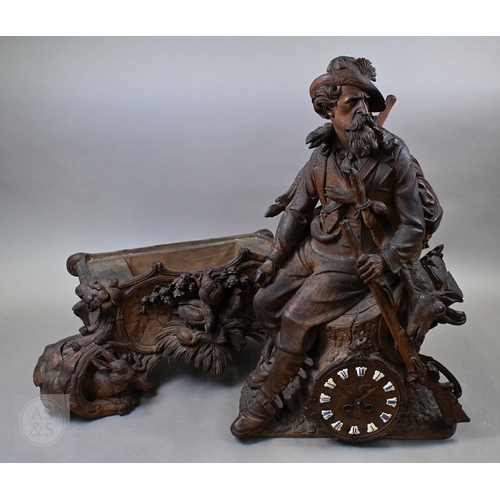 810 - J Huggler (1834-1912) a monumental carved Black Forest clock, late 19th century, carved as a seated ... 