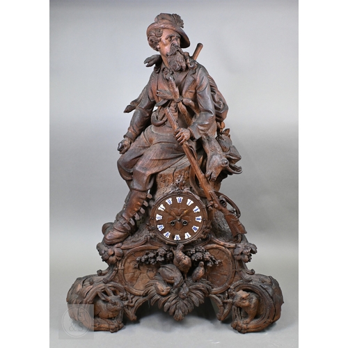 810 - J Huggler (1834-1912) a monumental carved Black Forest clock, late 19th century, carved as a seated ... 