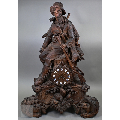 810 - J Huggler (1834-1912) a monumental carved Black Forest clock, late 19th century, carved as a seated ... 