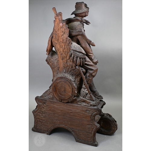 810 - J Huggler (1834-1912) a monumental carved Black Forest clock, late 19th century, carved as a seated ... 