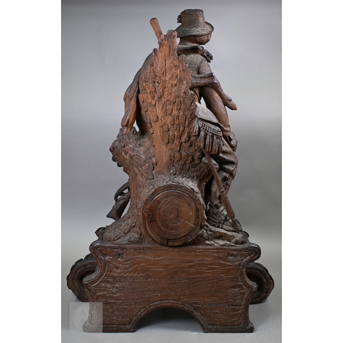 810 - J Huggler (1834-1912) a monumental carved Black Forest clock, late 19th century, carved as a seated ... 