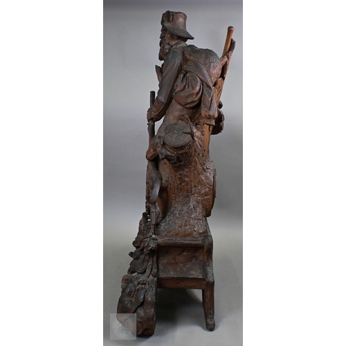 810 - J Huggler (1834-1912) a monumental carved Black Forest clock, late 19th century, carved as a seated ... 