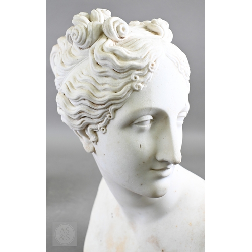 888 - An antique white marble bust of a classical female with ornate hair, on socle base, 62cm high