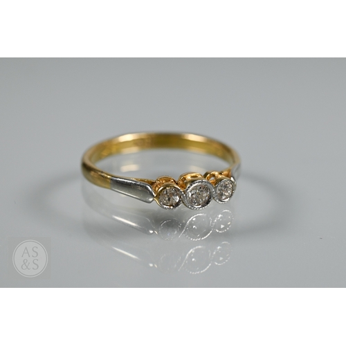 An antique three stone diamond ring, the three collet set diamonds in ...