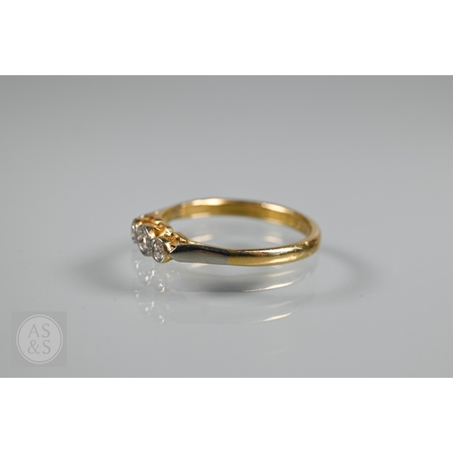 An antique three stone diamond ring, the three collet set diamonds in ...