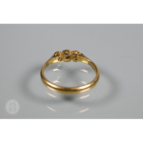 An antique three stone diamond ring, the three collet set diamonds in ...