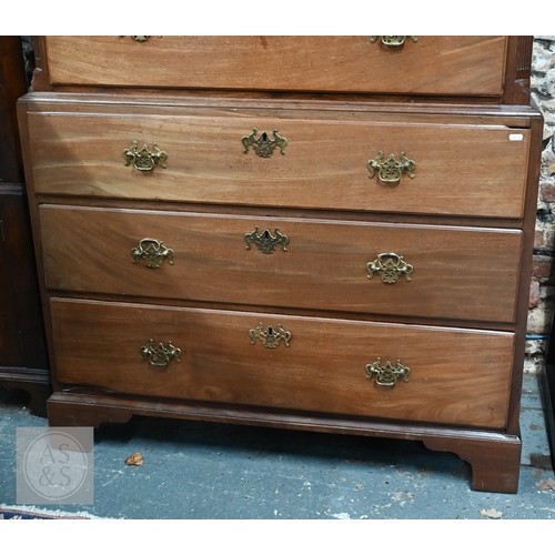 32 - A George III mahogany chest on chest, the moulded cornice with canted corners over two short and thr... 