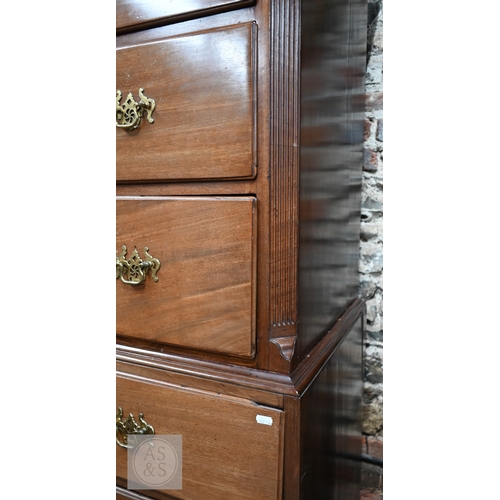 32 - A George III mahogany chest on chest, the moulded cornice with canted corners over two short and thr... 