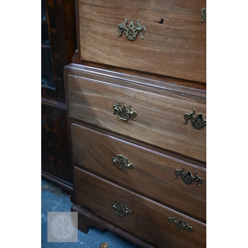 32 - A George III mahogany chest on chest, the moulded cornice with canted corners over two short and thr... 