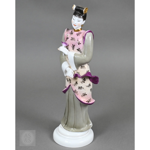 552 - A Royal Worcester figure of a Chinese lady, designed by Pinder Davis, no. 3419, 1956, 31cm high