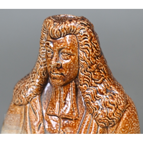 553 - An early 19th Century commemorative stoneware flask, modelled as Lord Brougham, holding the Reform B... 