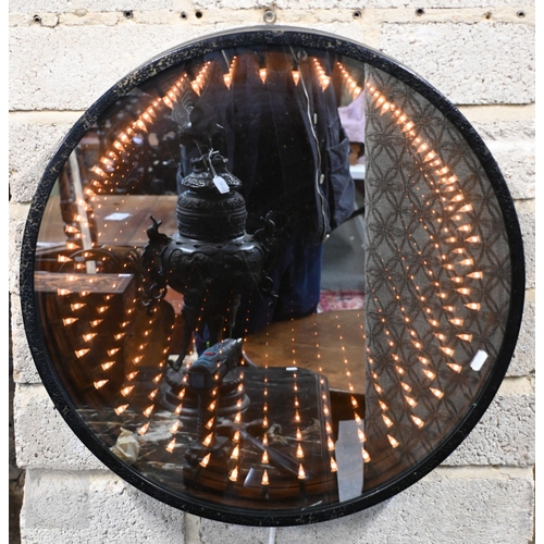 569 - A contemporary design circular 'Infinity' or 'Rabbit-Hole' mirror with painted frame and internal re... 