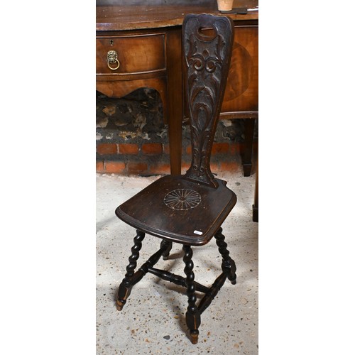 275 - # A late 19th century carved oak Welsh spinning chairs on barleytwist legs