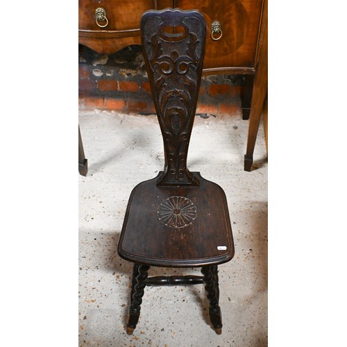 275 - # A late 19th century carved oak Welsh spinning chairs on barleytwist legs