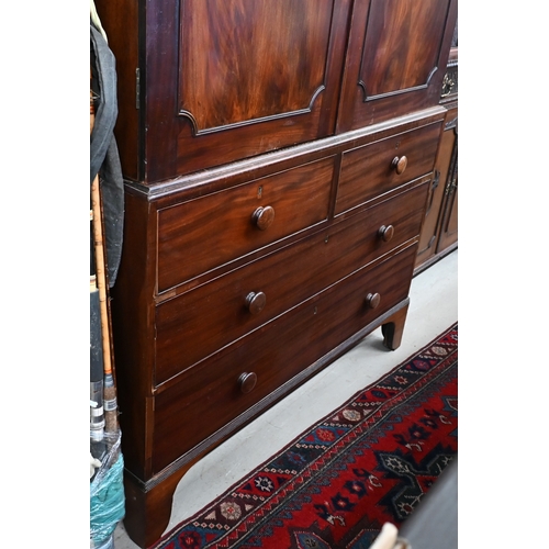 377 - A 19th century mahogany linen press with arched pediment and panelled doors (lacking slides) on ches... 