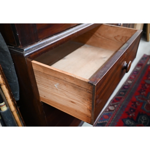 377 - A 19th century mahogany linen press with arched pediment and panelled doors (lacking slides) on ches... 