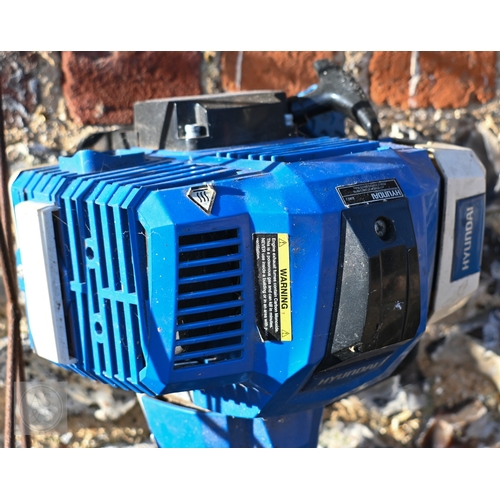 13 - A Hyundai petrol brush cutter c/with straps to/with a Honda 4.5 HP petrol hover mower and a Ryobi On... 