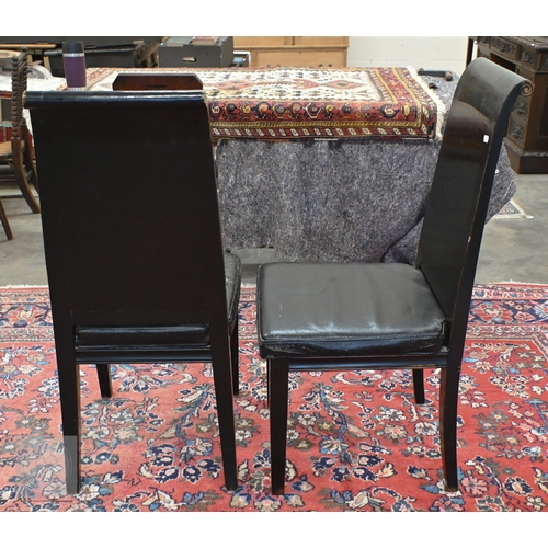 132 - A substantial Chinese black painted extending dining table with four optional leaves, each section i... 