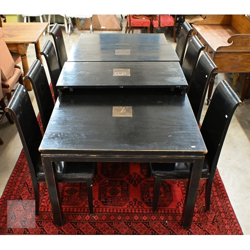 132 - A substantial Chinese black painted extending dining table with four optional leaves, each section i... 