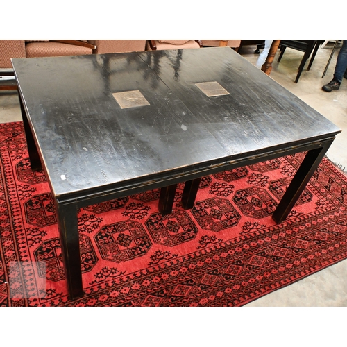 132 - A substantial Chinese black painted extending dining table with four optional leaves, each section i... 
