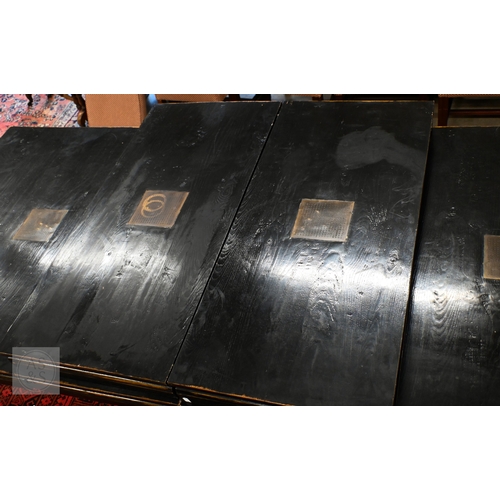 132 - A substantial Chinese black painted extending dining table with four optional leaves, each section i... 