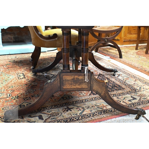 186 - A Regency style mahogany inlaid sofa table with two drawers and opposing dummy drawers on splayed le... 