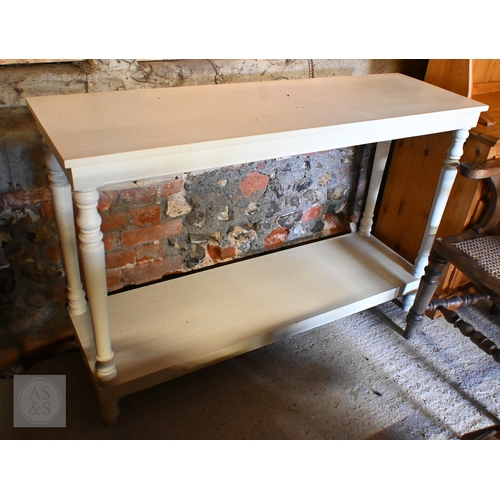198 - A modern cream-painted two-tier console table with turned supports, 130 x 40 x 86 cm high