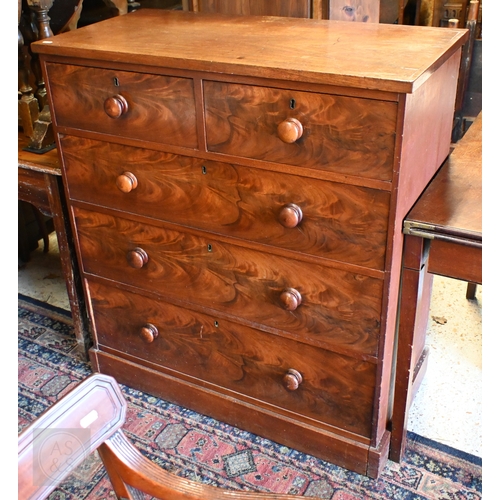 208 - A Victorian flame mahogany chest of two short over three long drawers with turned handles and plinth... 