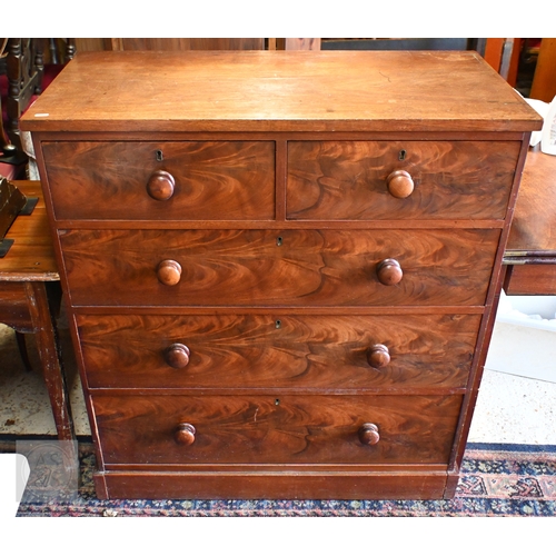 208 - A Victorian flame mahogany chest of two short over three long drawers with turned handles and plinth... 