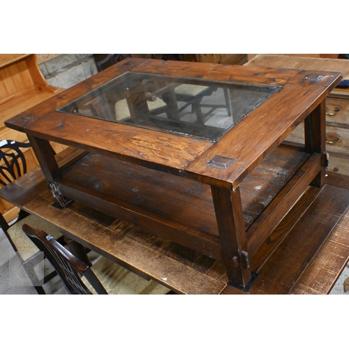 216 - A Lombok rustic-stained hardwood two-tier coffee table with inset glass top, 120 x 80 x 50 cm high