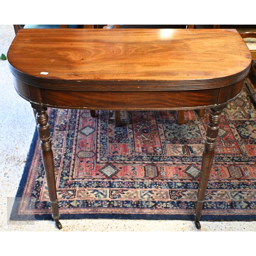 224 - A Victorian mahogany demi-lune folding tea table on turned legs with casters, 90 x 45 x 77 cm high (... 