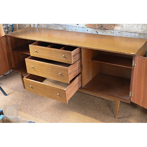 25 - A mid-century teak finished sideboard by Wrighton, centred by three drawers flanked by cupboards, ra... 