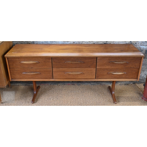26 - A mid-century teak sideboard by Austinsuite, with three over three short drawers and raised on trest... 