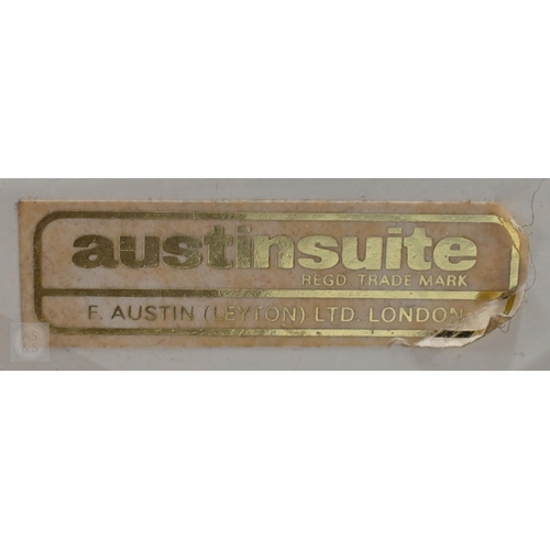 26 - A mid-century teak sideboard by Austinsuite, with three over three short drawers and raised on trest... 