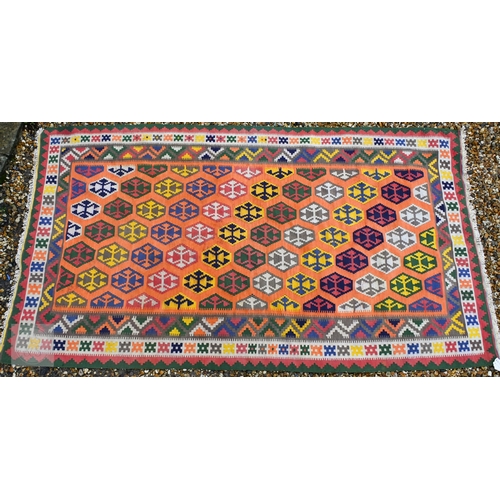 283 - A large orange ground South West Persian Qashqai kilim, geometric design with repeating hexagonal me... 