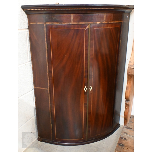 365 - # A 19th century mahogany inlaid two-door hanging corner cupboard