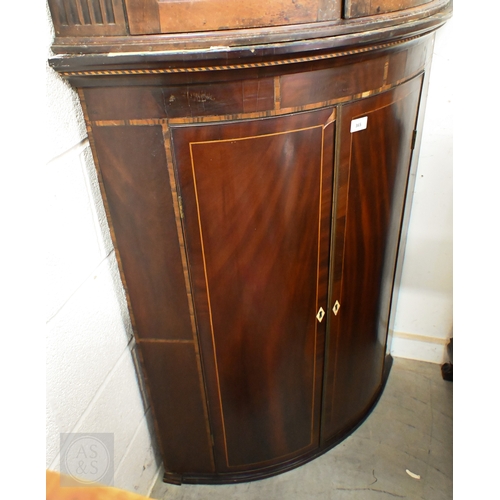 365 - # A 19th century mahogany inlaid two-door hanging corner cupboard