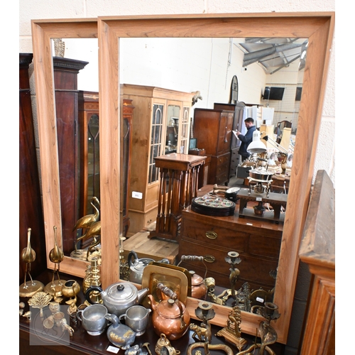 371 - A pair of modern bevelled mirrors in lightly stained moulded hardwood frames, 104 x 72 cm (2)