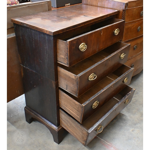 389 - A Georgian mahogany chest of four long drawers with oval brass handles, standing on shaped bracket f... 