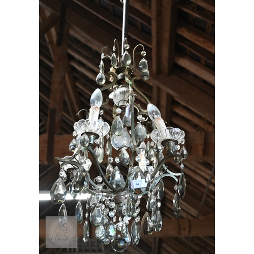 42 - A vintage style metal framed and smoked crystal hung four branch electrolier, centred by an addition... 