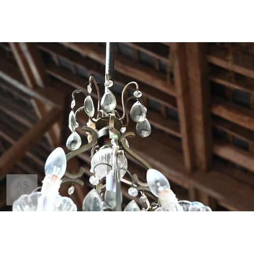 42 - A vintage style metal framed and smoked crystal hung four branch electrolier, centred by an addition... 