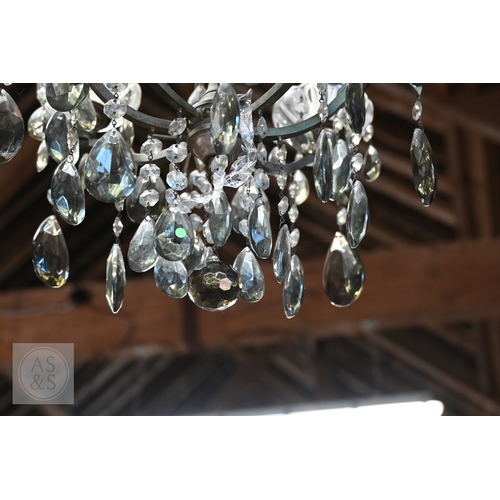 42 - A vintage style metal framed and smoked crystal hung four branch electrolier, centred by an addition... 