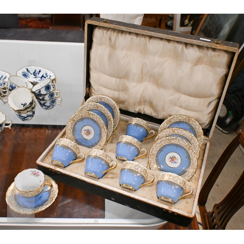 435 - A cased set of six Limoges coffee cans and saucers with silver overlays and a cased set of six Copel... 