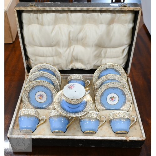 435 - A cased set of six Limoges coffee cans and saucers with silver overlays and a cased set of six Copel... 
