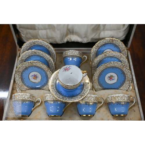 435 - A cased set of six Limoges coffee cans and saucers with silver overlays and a cased set of six Copel... 