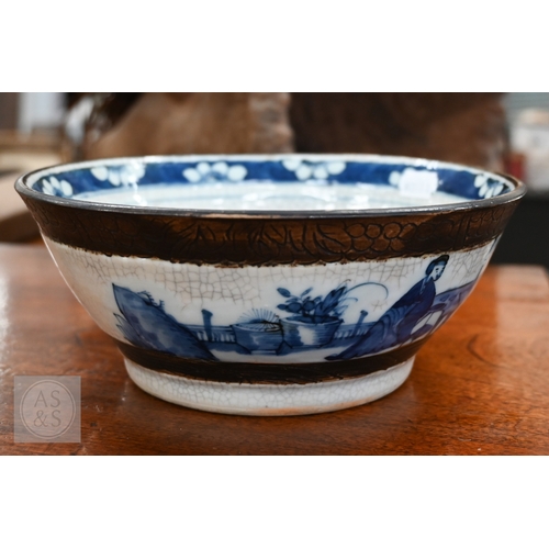 447A - A Chinese crackle-glazed bowl, painted with blue and white figures within burnt biscuit bands, 23 cm... 