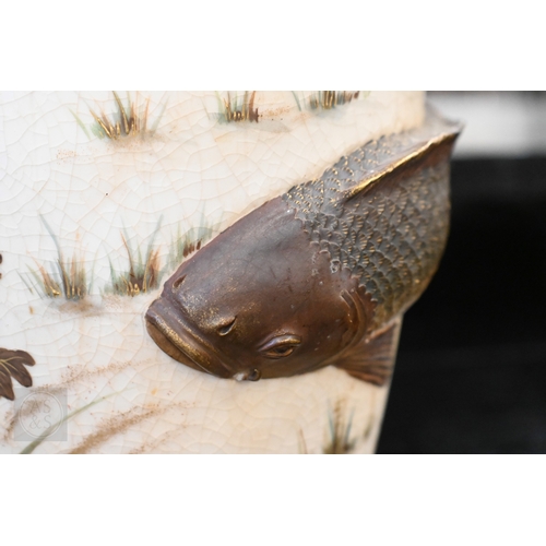 449 - A Japanese Meiji era pottery vase, relief-moulded with a carp leaping from a painted pond, with gild... 