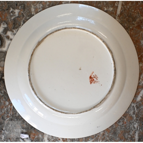 452 - An 18th century French Lille factory plate (ca 1790), painted with green and blue floral sprigs cent... 